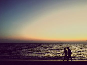 Scenic view of sea at sunset