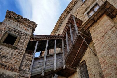 Low angle view of old building against sky