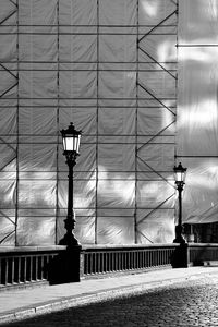 Low angle view of street light against building