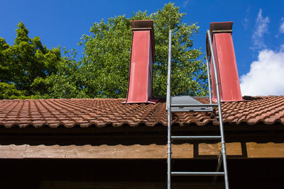 Red roof against blue sky