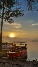 Scenic view of lake against sky during sunrise