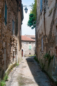 Narrow alley amidst buildings in town