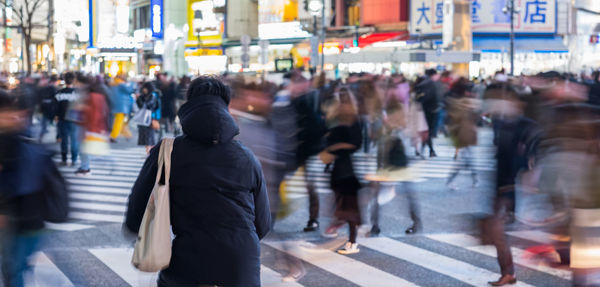 People walking on street in city