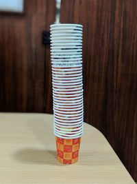 Close-up of colorful stack on wooden table