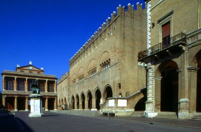Built structures against clear blue sky