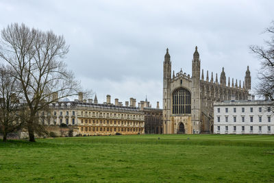 Buildings against cloudy sky