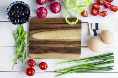 High angle view of fruits and vegetables on cutting board