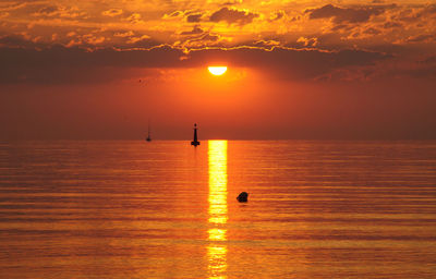 Scenic view of sea at sunset