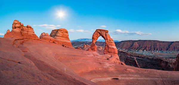 Rock formations on landscape against sky