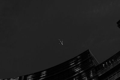 Low angle view of airplane flying in sky