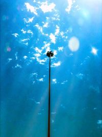 Low angle view of street light against blue sky