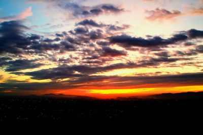 Scenic view of silhouette landscape against sky during sunset