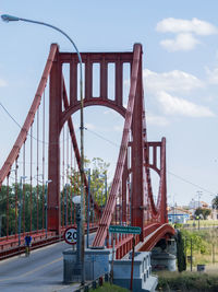 View of bridge against cloudy sky