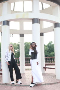 Full length fashion models standing at park