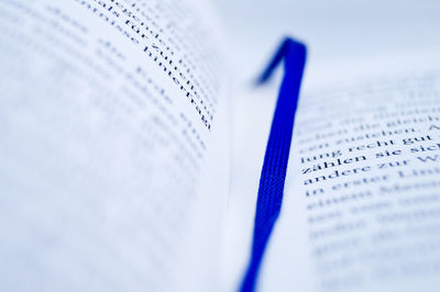 Close-up of book with blue bookmark