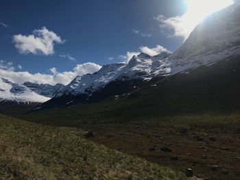 Scenic view of snowcapped mountains against sky