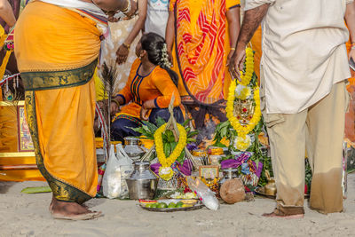 Low section of people standing on street