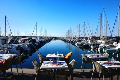 Boats moored at harbor