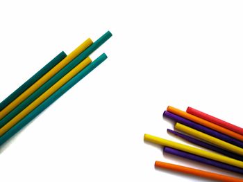 Close-up of colored pencils against white background