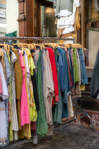 Clothes drying against buildings in city