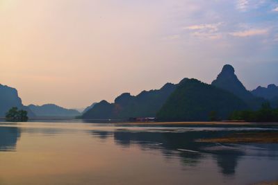 Scenic view of lake against sky during sunset