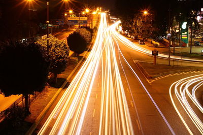 High angle view of light trails on road at night