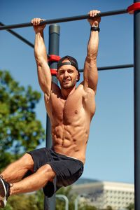 Rear view of man exercising in gym