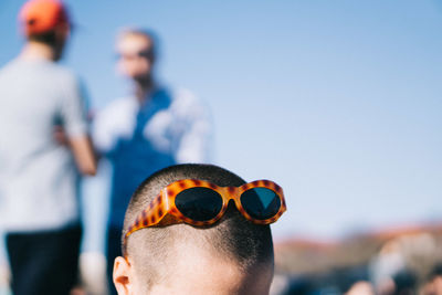 Close-up of boy wearing sunglasses on head