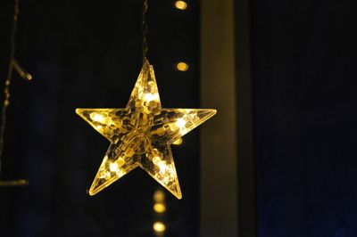 Close-up of illuminated christmas lights at night