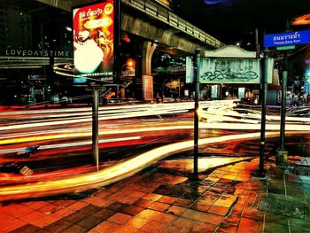 Illuminated railroad station platform at night