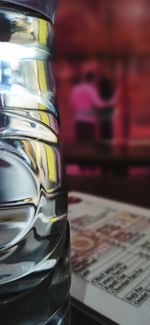 Close-up of glass of jar on table
