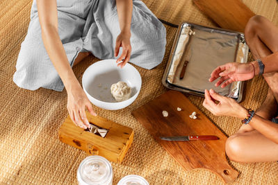 High angle view of woman using laptop on table