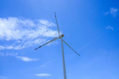 Low angle view of wind turbine against sky