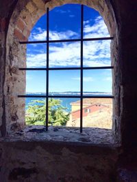 Close-up of sea seen through window