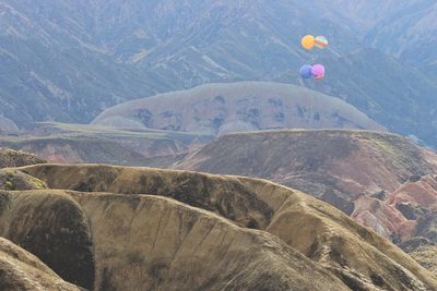 View of balloons on mountain