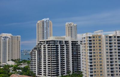 Low angle view of buildings against blue sky