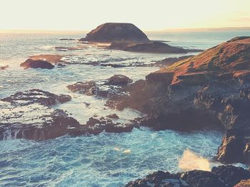 Scenic view of sea against clear sky during sunset