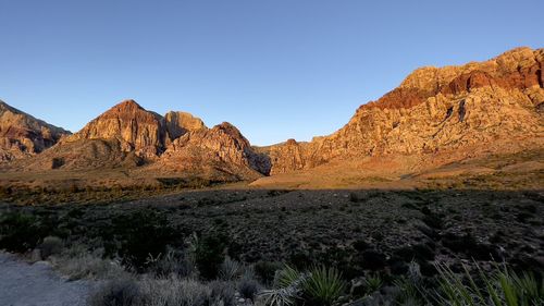 Scenic view of rocky mountains against clear sky