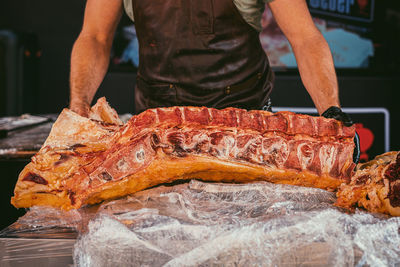 Midsection of man preparing food