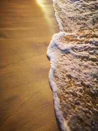 High angle view of surf on beach