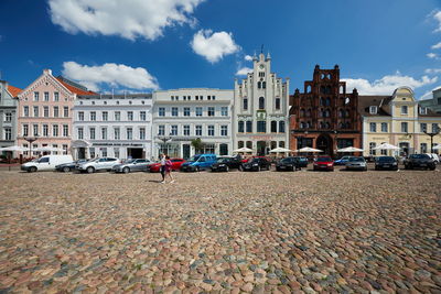 View of buildings against cloudy sky