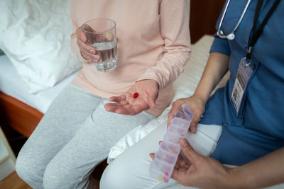 Midsection of woman holding ice cream