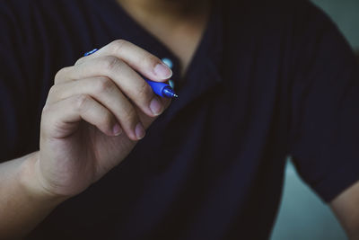 Close-up of woman holding hands