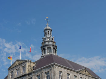 Low angle view of building against blue sky