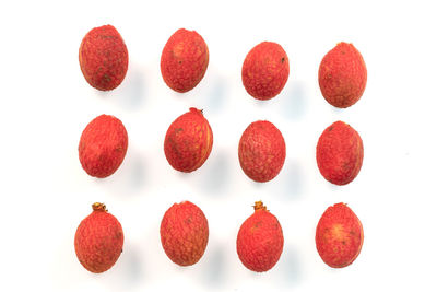 Directly above shot of fruits against white background