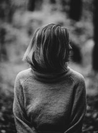 Rear view of woman standing outdoors