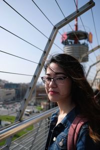 Portrait of young woman wearing eyeglasses