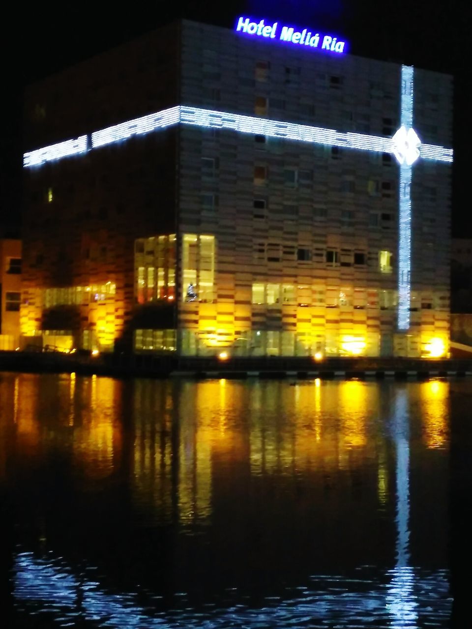 REFLECTION OF ILLUMINATED BUILDINGS IN WATER