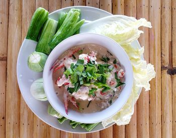 High angle view of chopped vegetables in bowl on table