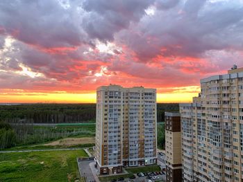 Buildings against sky during sunset